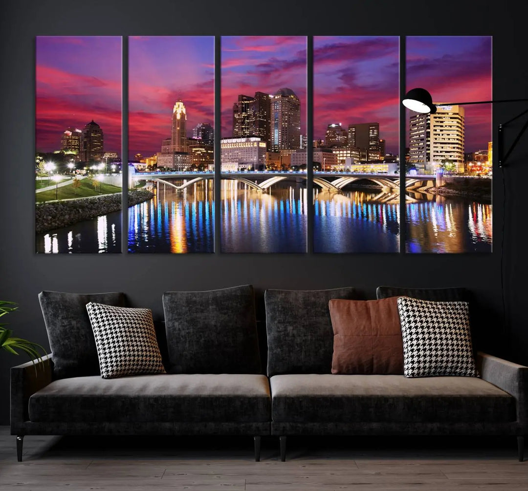 The "Columbus City Lights Sunset Pink and Purple Cloudy Skyline Cityscape View Wall Art Canvas Print" captures the beauty of a city skyline at dusk with its reflection on the river. Crafted on museum-quality canvas with a UV-protective coating, this triptych wall art is ready to hang and adds an elegant touch to any room.