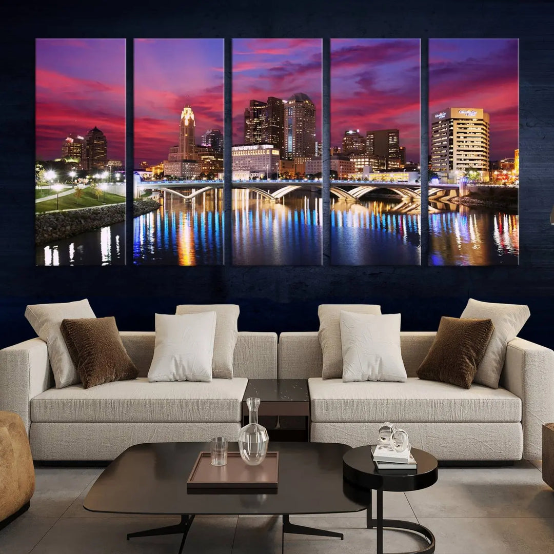 The "Columbus City Lights Sunset Pink and Purple Cloudy Skyline Cityscape View Wall Art Canvas Print" captures the beauty of a city skyline at dusk with its reflection on the river. Crafted on museum-quality canvas with a UV-protective coating, this triptych wall art is ready to hang and adds an elegant touch to any room.