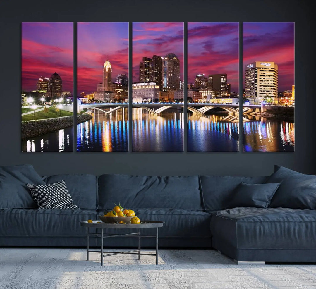 The "Columbus City Lights Sunset Pink and Purple Cloudy Skyline Cityscape View Wall Art Canvas Print" captures the beauty of a city skyline at dusk with its reflection on the river. Crafted on museum-quality canvas with a UV-protective coating, this triptych wall art is ready to hang and adds an elegant touch to any room.