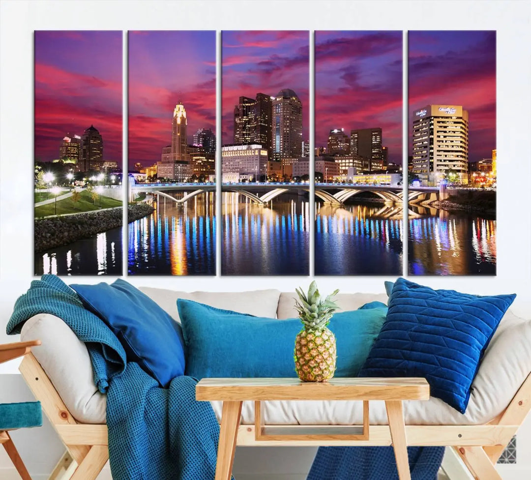 The "Columbus City Lights Sunset Pink and Purple Cloudy Skyline Cityscape View Wall Art Canvas Print" captures the beauty of a city skyline at dusk with its reflection on the river. Crafted on museum-quality canvas with a UV-protective coating, this triptych wall art is ready to hang and adds an elegant touch to any room.