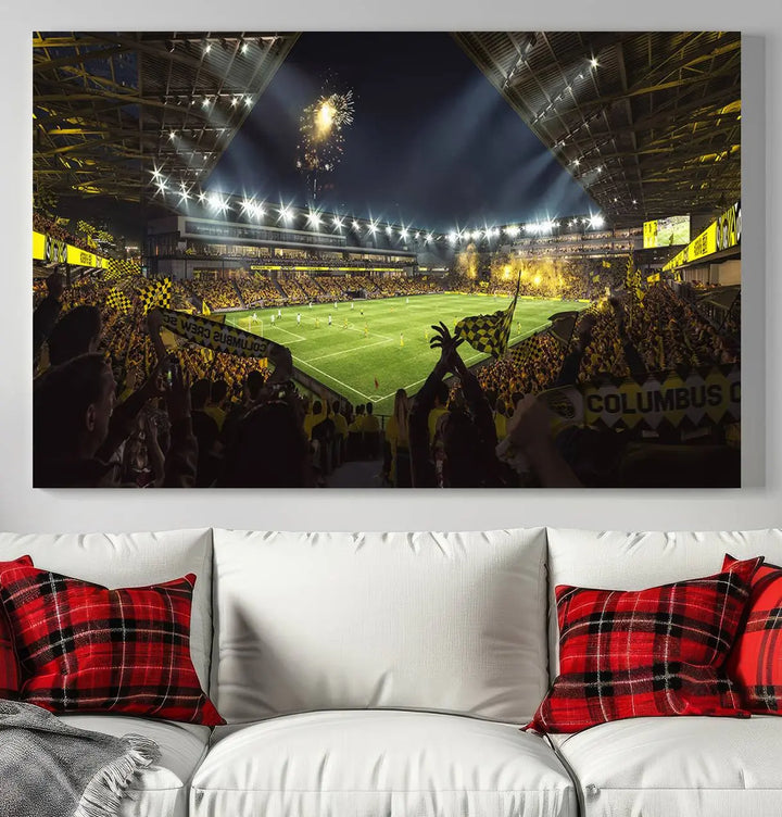 The wall of a modern living room is adorned with a triptych canvas titled "Columbus Crew Soccer Team Print," capturing the vibrant energy of the Columbus Crew Stadium in high-resolution printing.