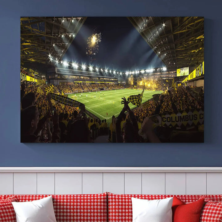 The wall of a modern living room is adorned with a triptych canvas titled "Columbus Crew Soccer Team Print," capturing the vibrant energy of the Columbus Crew Stadium in high-resolution printing.