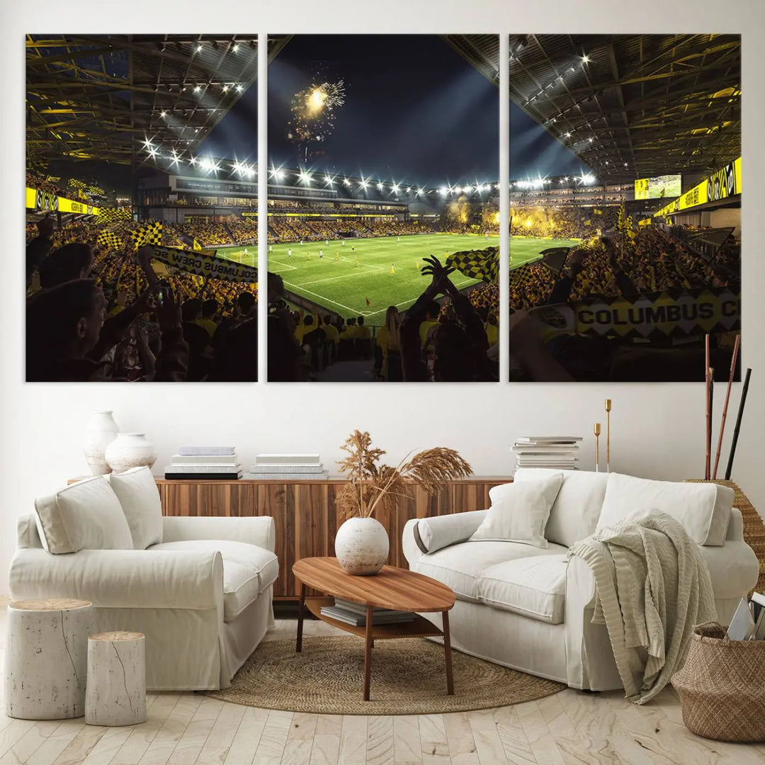 The wall of a modern living room is adorned with a triptych canvas titled "Columbus Crew Soccer Team Print," capturing the vibrant energy of the Columbus Crew Stadium in high-resolution printing.