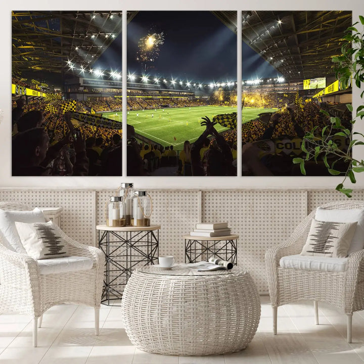 The wall of a modern living room is adorned with a triptych canvas titled "Columbus Crew Soccer Team Print," capturing the vibrant energy of the Columbus Crew Stadium in high-resolution printing.