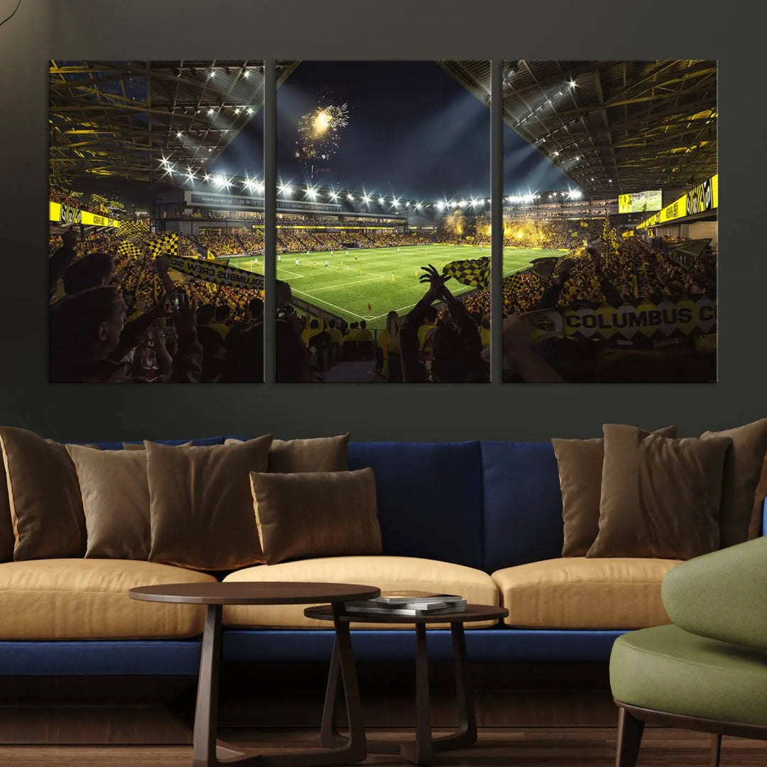 The wall of a modern living room is adorned with a triptych canvas titled "Columbus Crew Soccer Team Print," capturing the vibrant energy of the Columbus Crew Stadium in high-resolution printing.