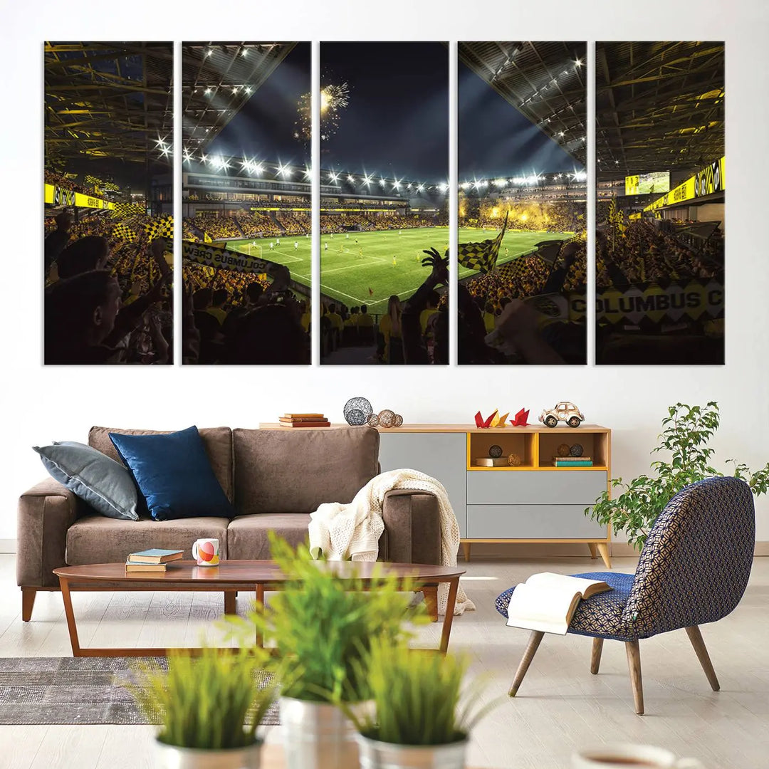 The wall of a modern living room is adorned with a triptych canvas titled "Columbus Crew Soccer Team Print," capturing the vibrant energy of the Columbus Crew Stadium in high-resolution printing.