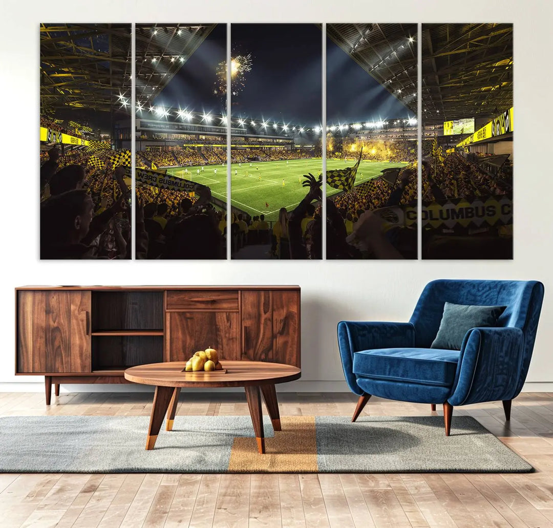 The wall of a modern living room is adorned with a triptych canvas titled "Columbus Crew Soccer Team Print," capturing the vibrant energy of the Columbus Crew Stadium in high-resolution printing.