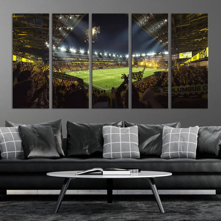 The wall of a modern living room is adorned with a triptych canvas titled "Columbus Crew Soccer Team Print," capturing the vibrant energy of the Columbus Crew Stadium in high-resolution printing.