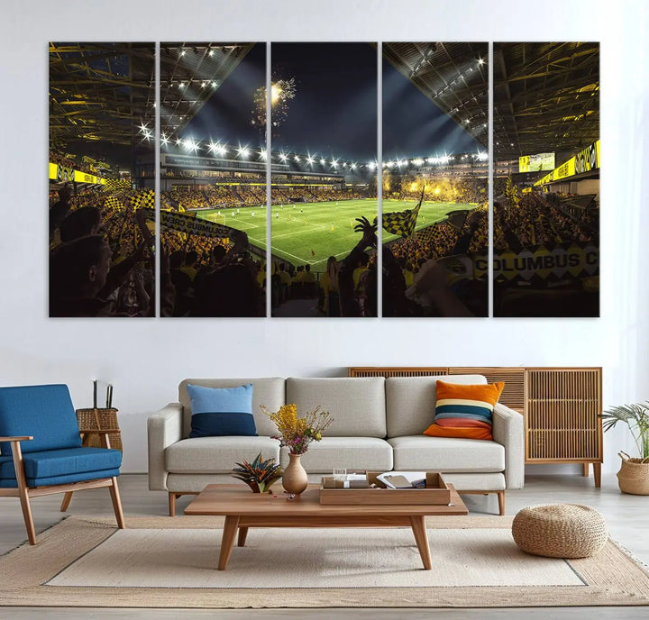 The wall of a modern living room is adorned with a triptych canvas titled "Columbus Crew Soccer Team Print," capturing the vibrant energy of the Columbus Crew Stadium in high-resolution printing.