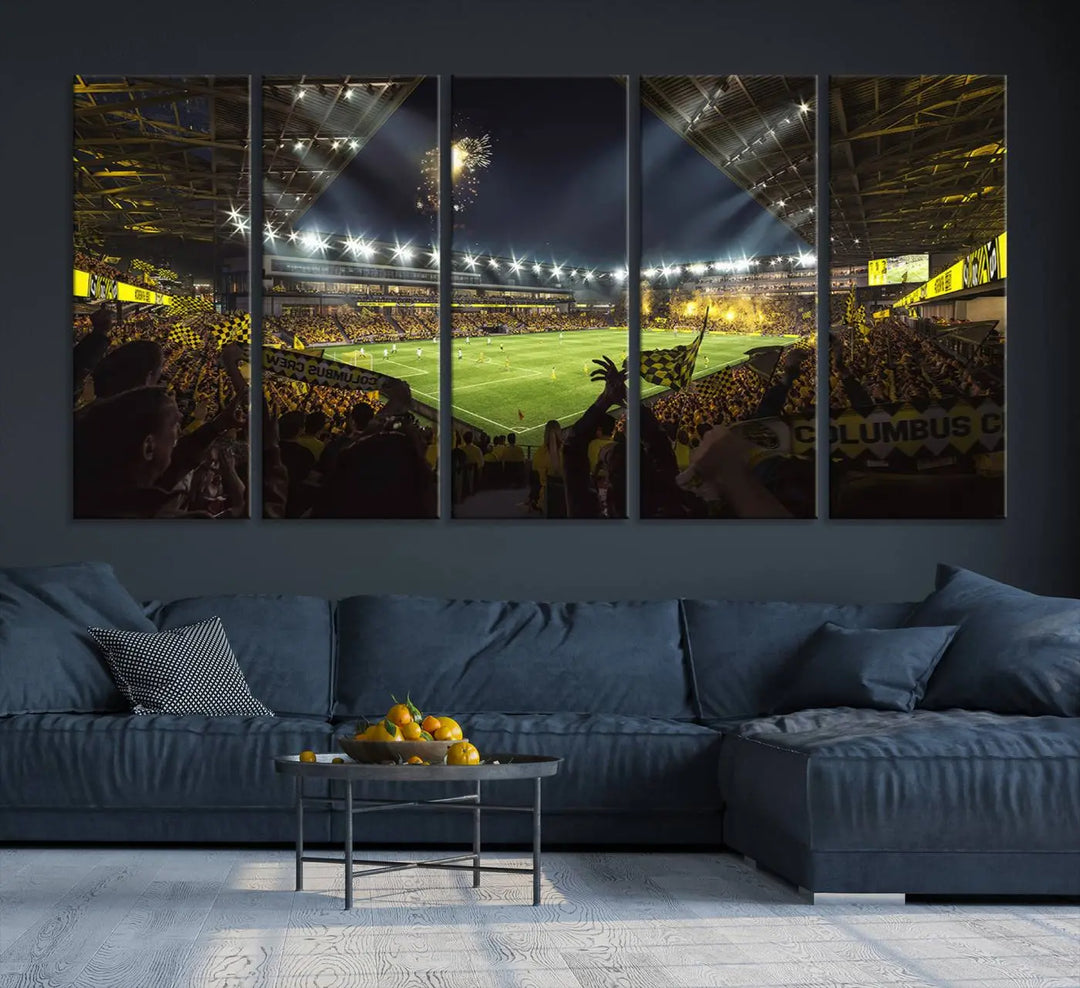 The wall of a modern living room is adorned with a triptych canvas titled "Columbus Crew Soccer Team Print," capturing the vibrant energy of the Columbus Crew Stadium in high-resolution printing.