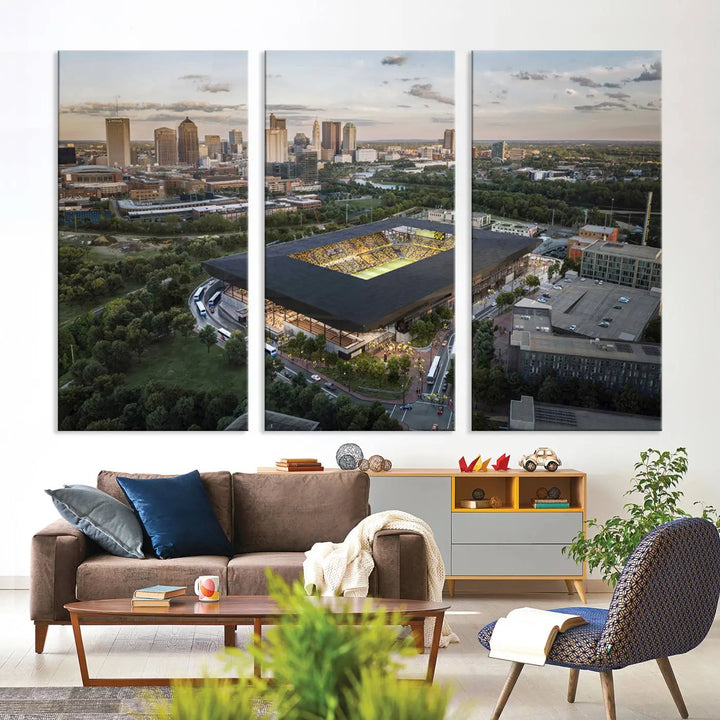 A living room is adorned with the Columbus Crew Soccer Team Print, showcasing a triptych of Columbus Crew Stadium and cityscape on museum-quality canvas. The high-resolution printing ensures vivid detail, while a UV-protective coating preserves its brilliance.