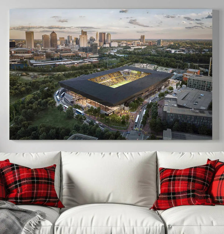 A living room is adorned with the Columbus Crew Soccer Team Print, showcasing a triptych of Columbus Crew Stadium and cityscape on museum-quality canvas. The high-resolution printing ensures vivid detail, while a UV-protective coating preserves its brilliance.