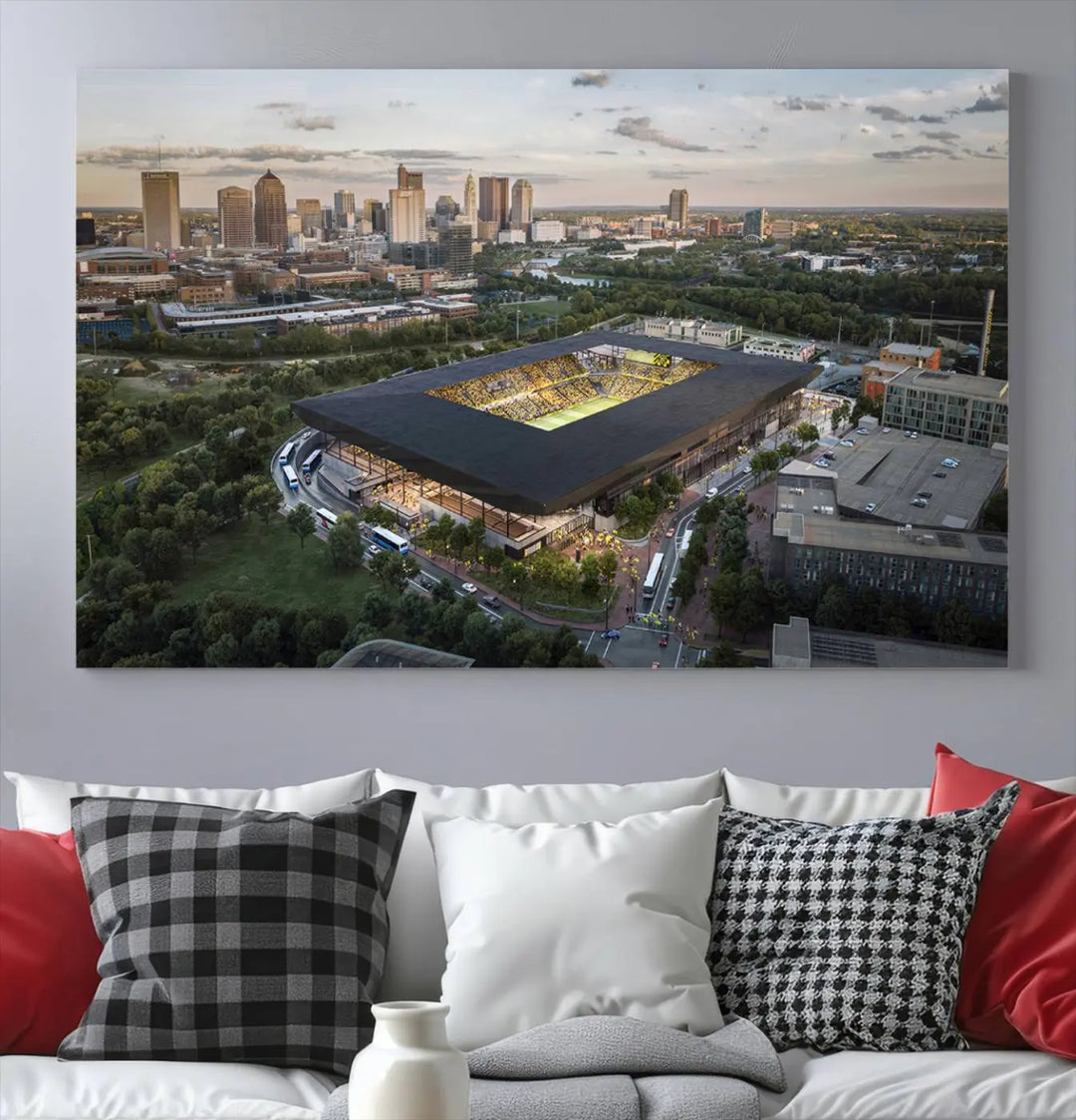 A living room is adorned with the Columbus Crew Soccer Team Print, showcasing a triptych of Columbus Crew Stadium and cityscape on museum-quality canvas. The high-resolution printing ensures vivid detail, while a UV-protective coating preserves its brilliance.