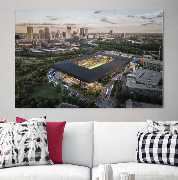 A living room is adorned with the Columbus Crew Soccer Team Print, showcasing a triptych of Columbus Crew Stadium and cityscape on museum-quality canvas. The high-resolution printing ensures vivid detail, while a UV-protective coating preserves its brilliance.