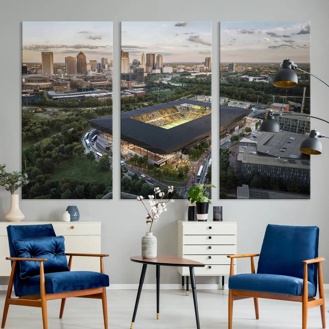 A living room is adorned with the Columbus Crew Soccer Team Print, showcasing a triptych of Columbus Crew Stadium and cityscape on museum-quality canvas. The high-resolution printing ensures vivid detail, while a UV-protective coating preserves its brilliance.