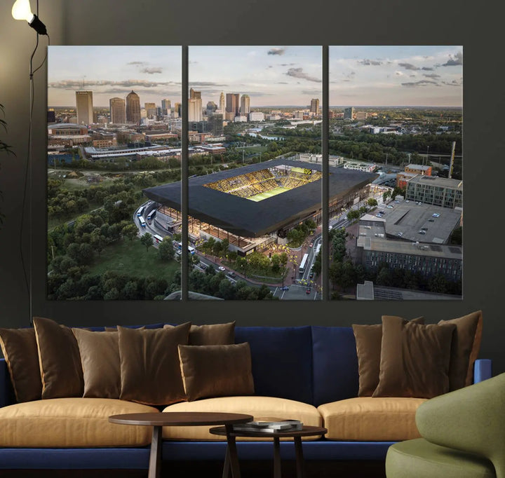 A living room is adorned with the Columbus Crew Soccer Team Print, showcasing a triptych of Columbus Crew Stadium and cityscape on museum-quality canvas. The high-resolution printing ensures vivid detail, while a UV-protective coating preserves its brilliance.