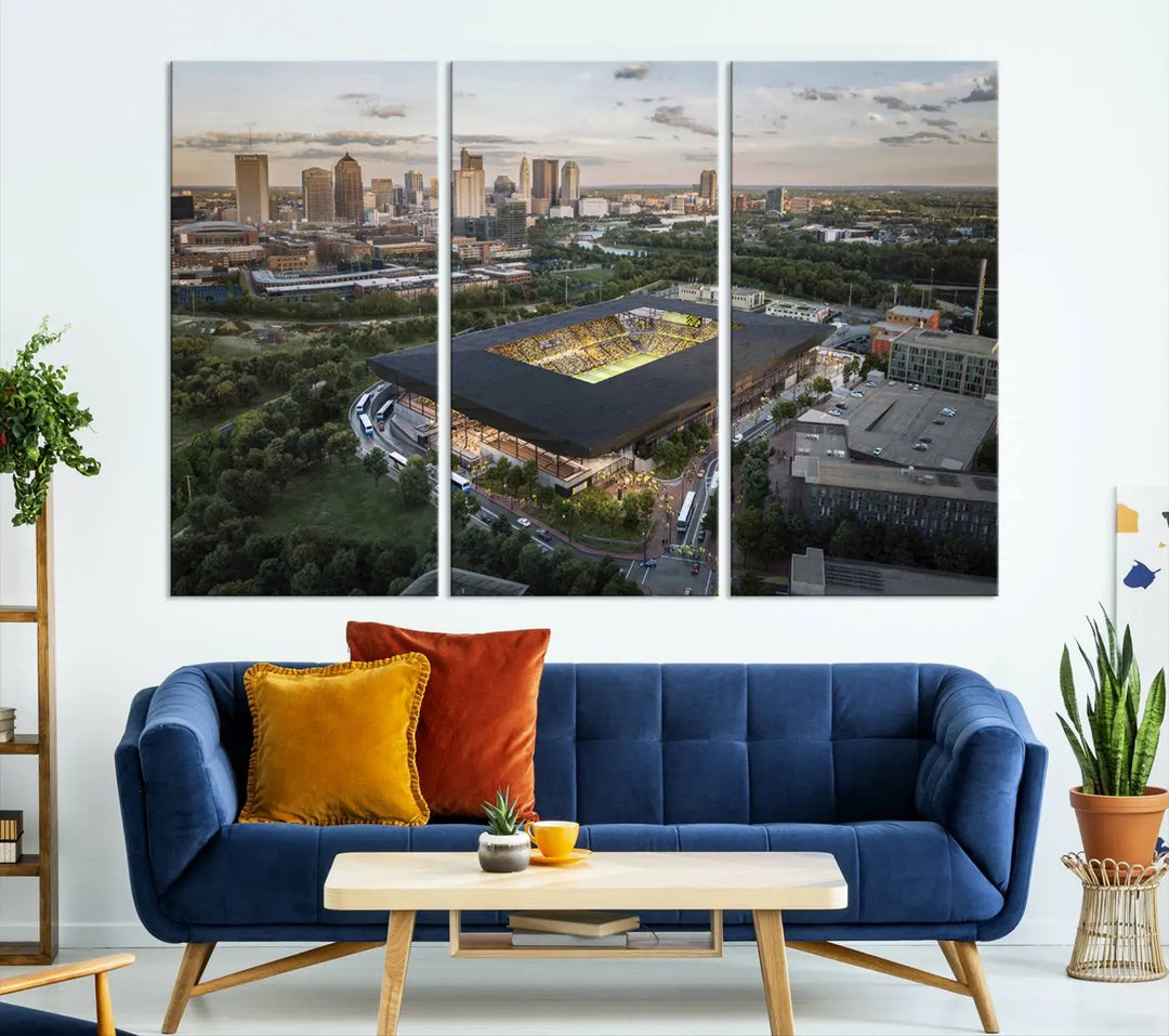 A living room is adorned with the Columbus Crew Soccer Team Print, showcasing a triptych of Columbus Crew Stadium and cityscape on museum-quality canvas. The high-resolution printing ensures vivid detail, while a UV-protective coating preserves its brilliance.