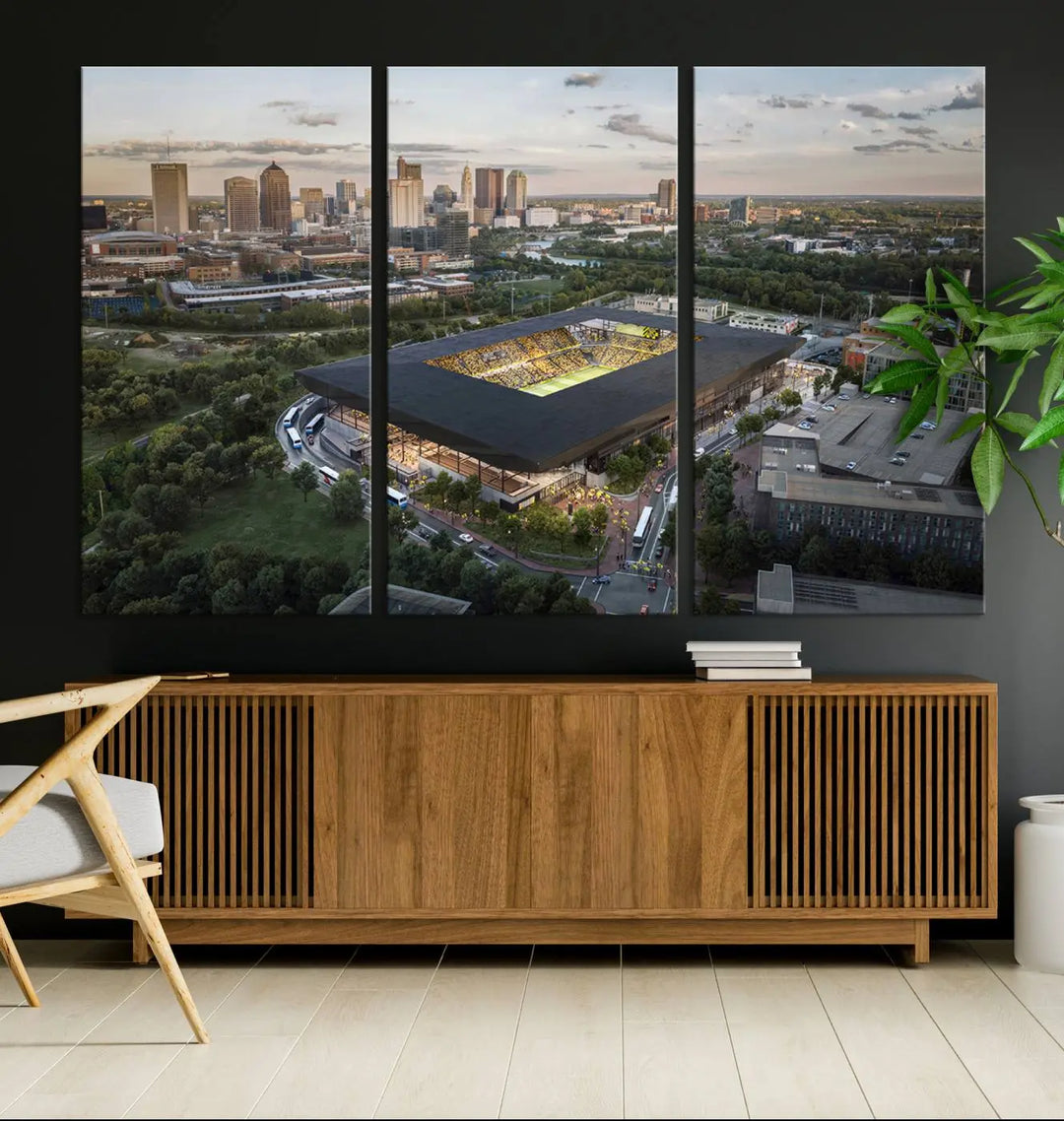 A living room is adorned with the Columbus Crew Soccer Team Print, showcasing a triptych of Columbus Crew Stadium and cityscape on museum-quality canvas. The high-resolution printing ensures vivid detail, while a UV-protective coating preserves its brilliance.