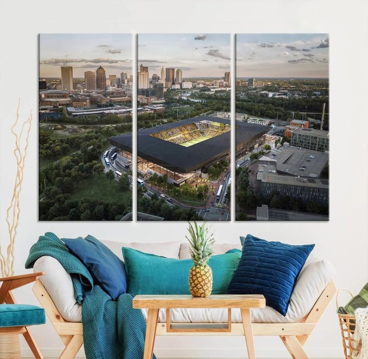 A living room is adorned with the Columbus Crew Soccer Team Print, showcasing a triptych of Columbus Crew Stadium and cityscape on museum-quality canvas. The high-resolution printing ensures vivid detail, while a UV-protective coating preserves its brilliance.