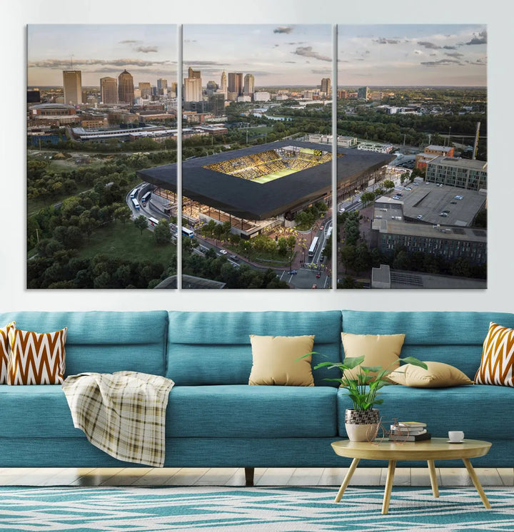 A living room is adorned with the Columbus Crew Soccer Team Print, showcasing a triptych of Columbus Crew Stadium and cityscape on museum-quality canvas. The high-resolution printing ensures vivid detail, while a UV-protective coating preserves its brilliance.