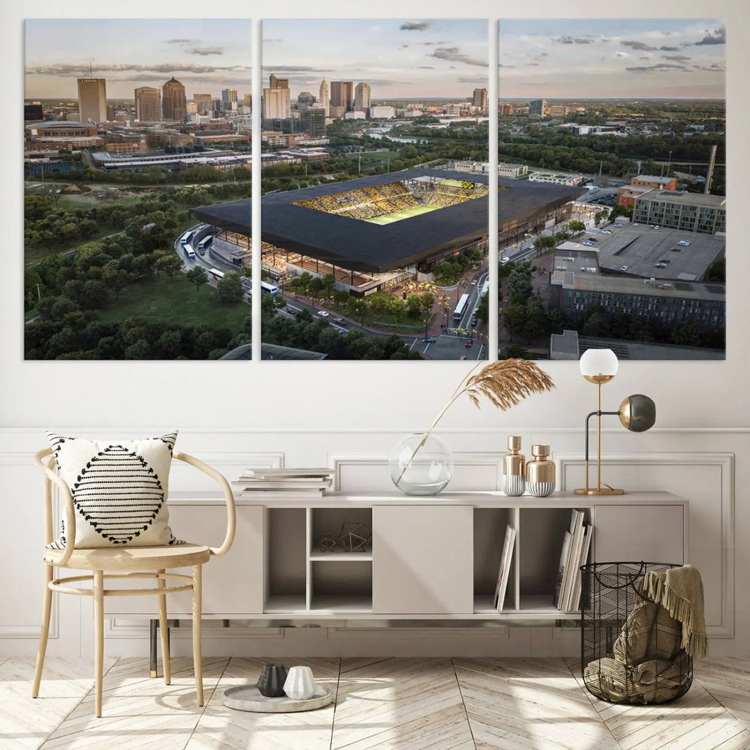 A living room is adorned with the Columbus Crew Soccer Team Print, showcasing a triptych of Columbus Crew Stadium and cityscape on museum-quality canvas. The high-resolution printing ensures vivid detail, while a UV-protective coating preserves its brilliance.