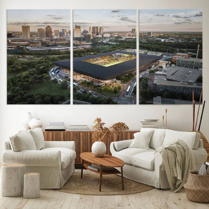 A living room is adorned with the Columbus Crew Soccer Team Print, showcasing a triptych of Columbus Crew Stadium and cityscape on museum-quality canvas. The high-resolution printing ensures vivid detail, while a UV-protective coating preserves its brilliance.