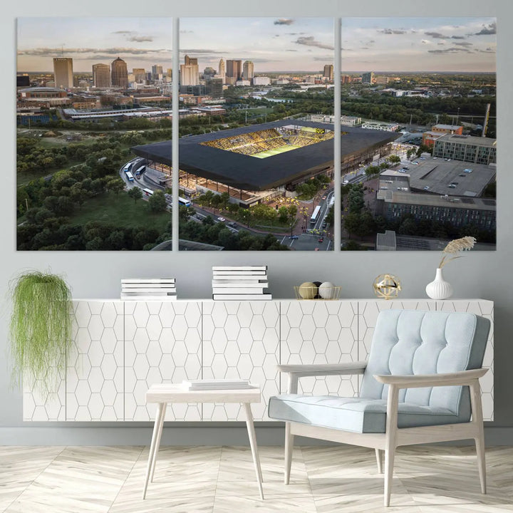 A living room is adorned with the Columbus Crew Soccer Team Print, showcasing a triptych of Columbus Crew Stadium and cityscape on museum-quality canvas. The high-resolution printing ensures vivid detail, while a UV-protective coating preserves its brilliance.