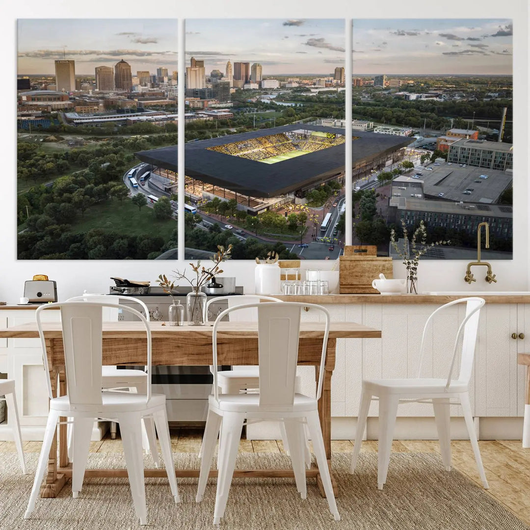 A living room is adorned with the Columbus Crew Soccer Team Print, showcasing a triptych of Columbus Crew Stadium and cityscape on museum-quality canvas. The high-resolution printing ensures vivid detail, while a UV-protective coating preserves its brilliance.