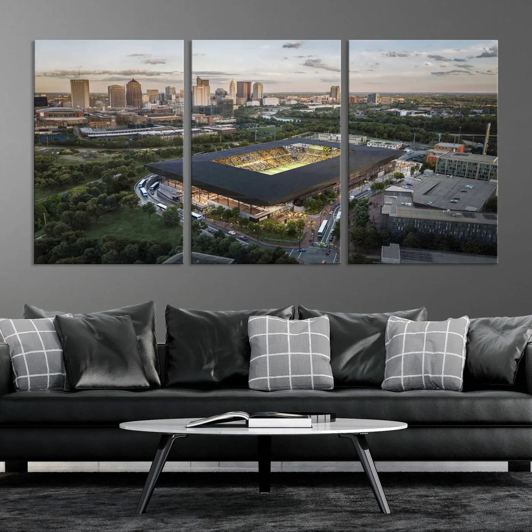 A living room is adorned with the Columbus Crew Soccer Team Print, showcasing a triptych of Columbus Crew Stadium and cityscape on museum-quality canvas. The high-resolution printing ensures vivid detail, while a UV-protective coating preserves its brilliance.