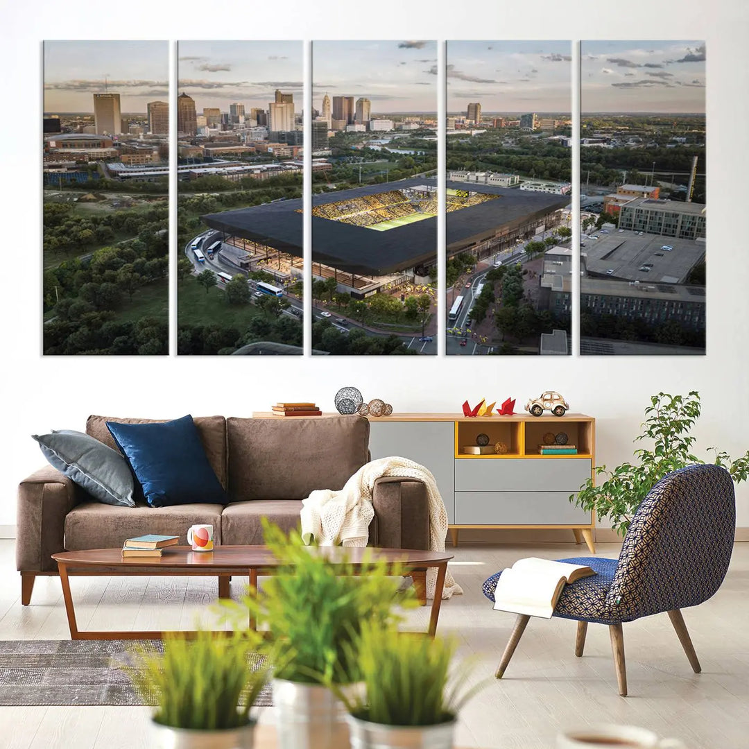 A living room is adorned with the Columbus Crew Soccer Team Print, showcasing a triptych of Columbus Crew Stadium and cityscape on museum-quality canvas. The high-resolution printing ensures vivid detail, while a UV-protective coating preserves its brilliance.