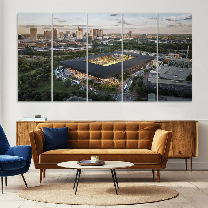 A living room is adorned with the Columbus Crew Soccer Team Print, showcasing a triptych of Columbus Crew Stadium and cityscape on museum-quality canvas. The high-resolution printing ensures vivid detail, while a UV-protective coating preserves its brilliance.