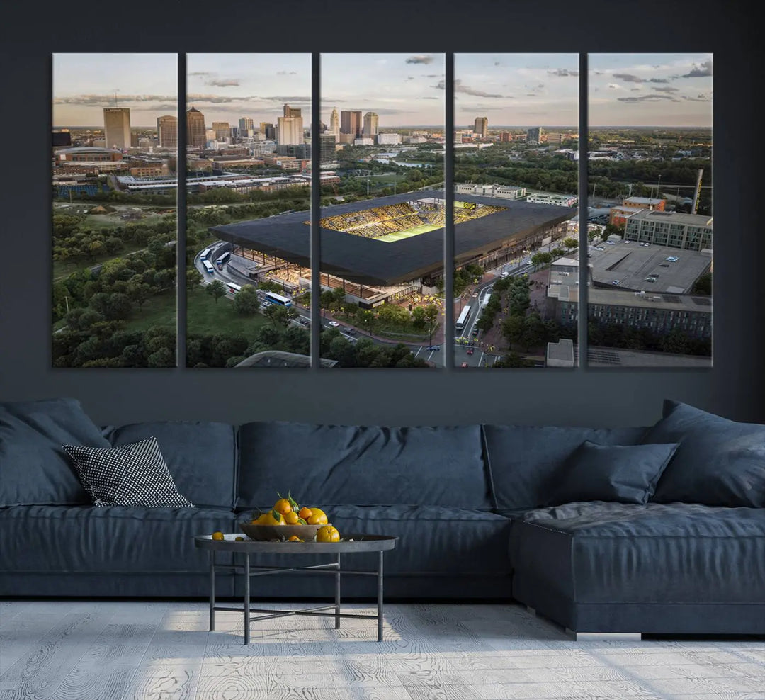 A living room is adorned with the Columbus Crew Soccer Team Print, showcasing a triptych of Columbus Crew Stadium and cityscape on museum-quality canvas. The high-resolution printing ensures vivid detail, while a UV-protective coating preserves its brilliance.