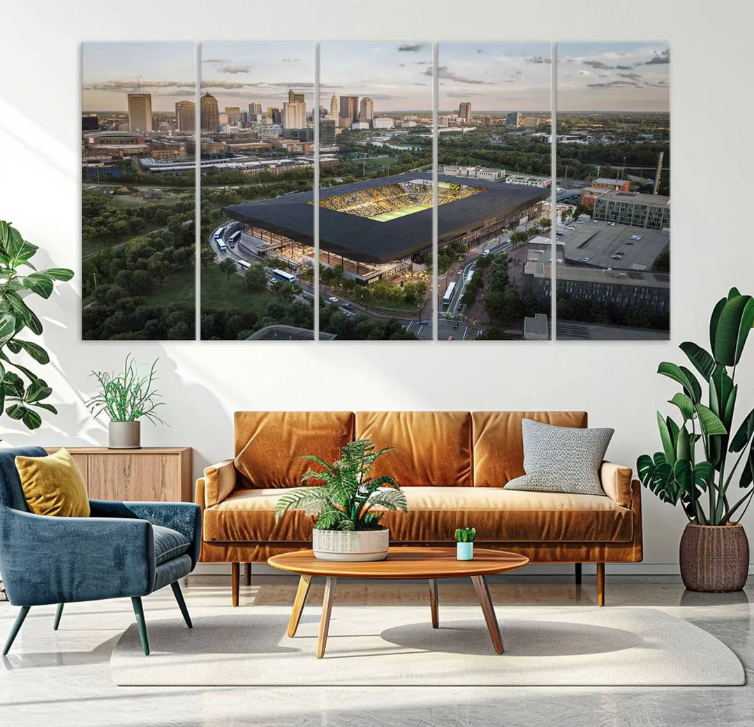 A living room is adorned with the Columbus Crew Soccer Team Print, showcasing a triptych of Columbus Crew Stadium and cityscape on museum-quality canvas. The high-resolution printing ensures vivid detail, while a UV-protective coating preserves its brilliance.