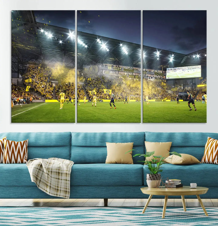 The Columbus Crew Stadium Match Triple Canvas Wall Art, featuring a dynamic MLS game scene, captures the excitement of a thrilling soccer match with stadium lights illuminating the field and crowd.