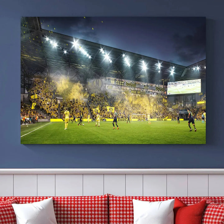 The Columbus Crew Stadium Match Triple Canvas Wall Art, featuring a dynamic MLS game scene, captures the excitement of a thrilling soccer match with stadium lights illuminating the field and crowd.