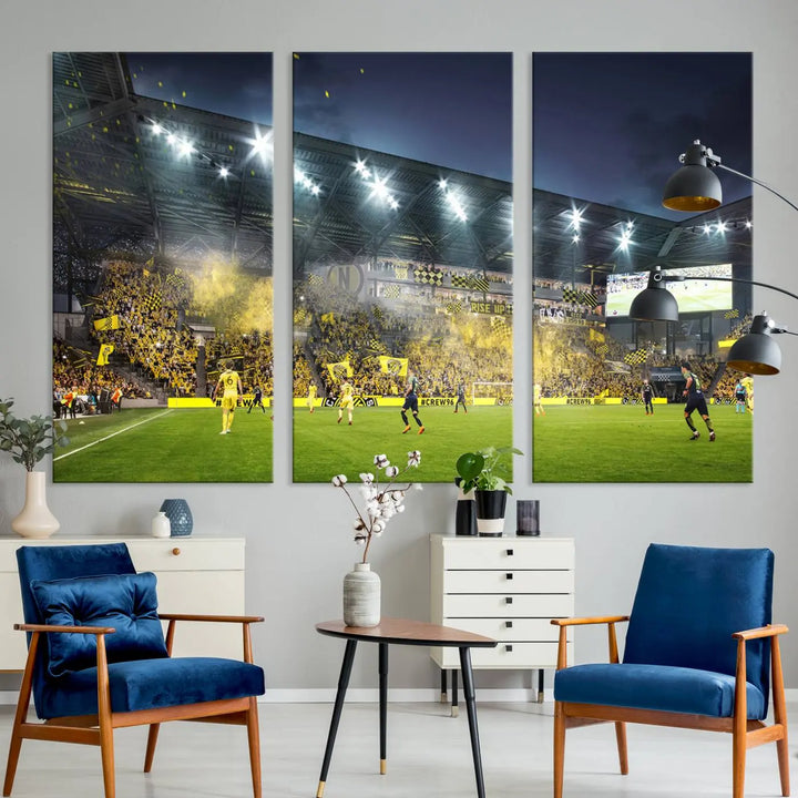 The Columbus Crew Stadium Match Triple Canvas Wall Art, featuring a dynamic MLS game scene, captures the excitement of a thrilling soccer match with stadium lights illuminating the field and crowd.