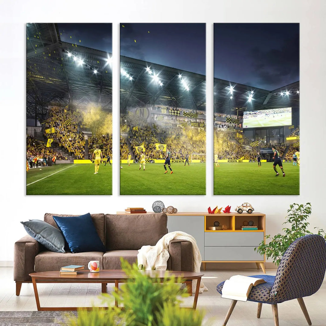 The Columbus Crew Stadium Match Triple Canvas Wall Art, featuring a dynamic MLS game scene, captures the excitement of a thrilling soccer match with stadium lights illuminating the field and crowd.