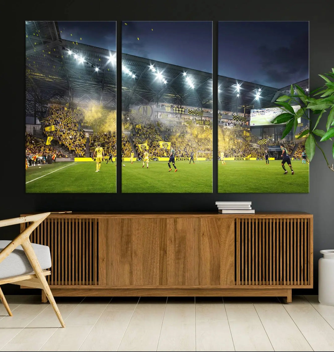 The Columbus Crew Stadium Match Triple Canvas Wall Art, featuring a dynamic MLS game scene, captures the excitement of a thrilling soccer match with stadium lights illuminating the field and crowd.