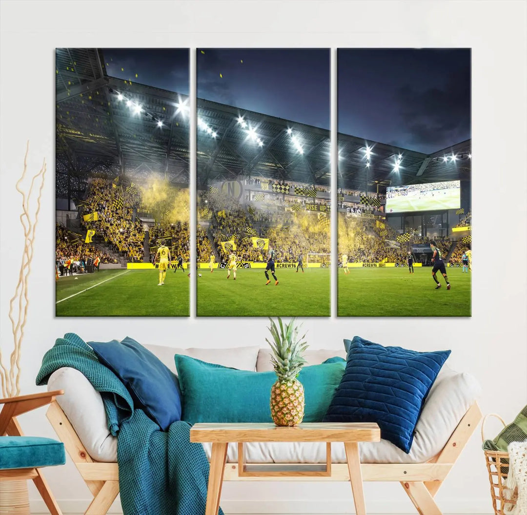 The Columbus Crew Stadium Match Triple Canvas Wall Art, featuring a dynamic MLS game scene, captures the excitement of a thrilling soccer match with stadium lights illuminating the field and crowd.