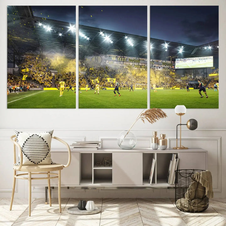 The Columbus Crew Stadium Match Triple Canvas Wall Art, featuring a dynamic MLS game scene, captures the excitement of a thrilling soccer match with stadium lights illuminating the field and crowd.