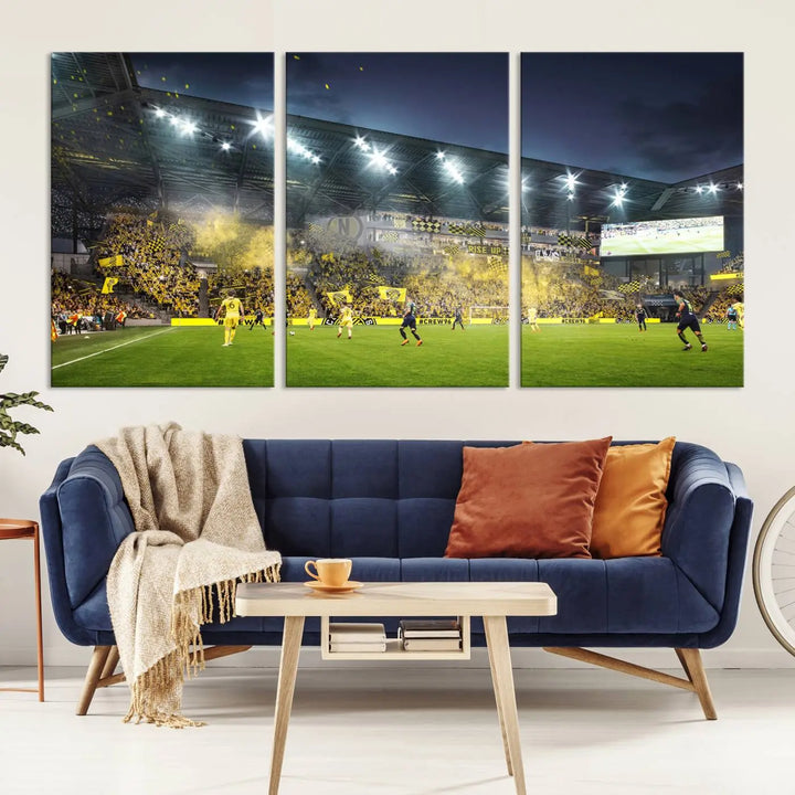 The Columbus Crew Stadium Match Triple Canvas Wall Art, featuring a dynamic MLS game scene, captures the excitement of a thrilling soccer match with stadium lights illuminating the field and crowd.