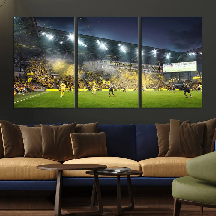 The Columbus Crew Stadium Match Triple Canvas Wall Art, featuring a dynamic MLS game scene, captures the excitement of a thrilling soccer match with stadium lights illuminating the field and crowd.