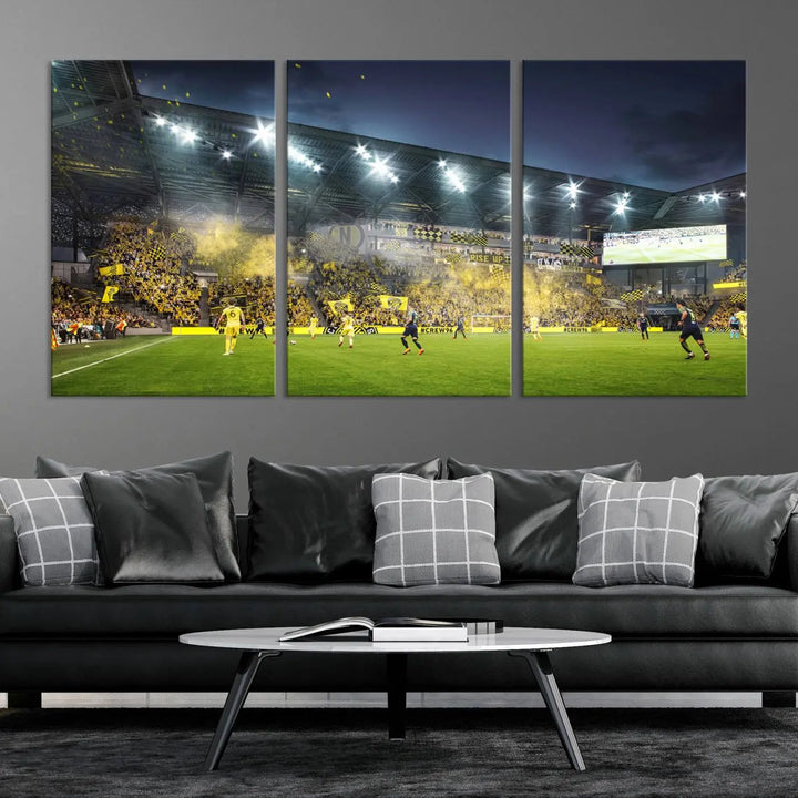 The Columbus Crew Stadium Match Triple Canvas Wall Art, featuring a dynamic MLS game scene, captures the excitement of a thrilling soccer match with stadium lights illuminating the field and crowd.