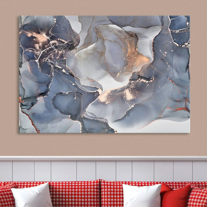 A Contemporary Art Gray Gold Abstract Canvas Art Print on museum-quality canvas adorns the modern living room.