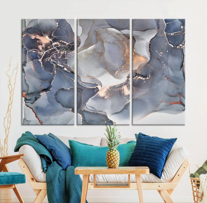 A Contemporary Art Gray Gold Abstract Canvas Art Print on museum-quality canvas adorns the modern living room.