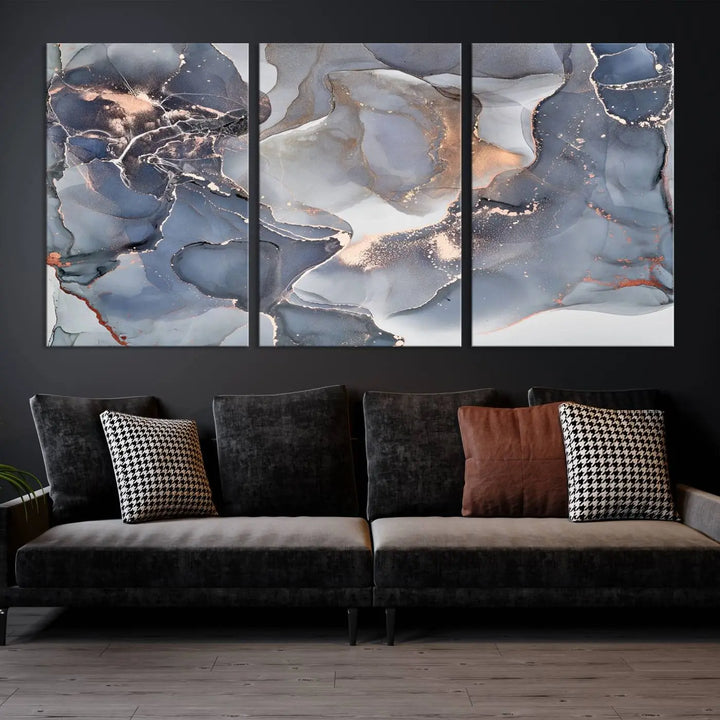 A Contemporary Art Gray Gold Abstract Canvas Art Print on museum-quality canvas adorns the modern living room.