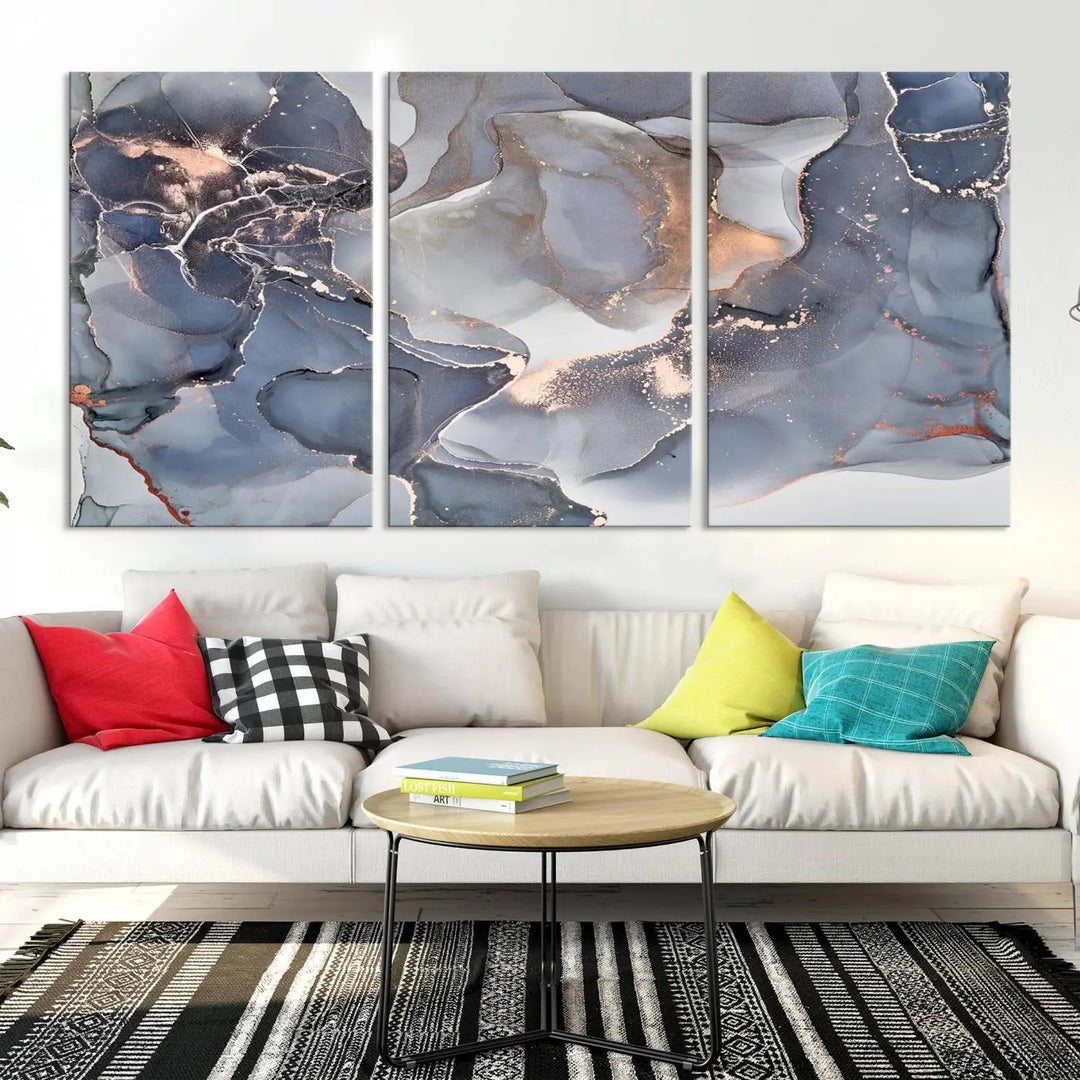 A Contemporary Art Gray Gold Abstract Canvas Art Print on museum-quality canvas adorns the modern living room.