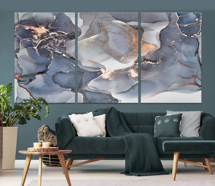 A Contemporary Art Gray Gold Abstract Canvas Art Print on museum-quality canvas adorns the modern living room.