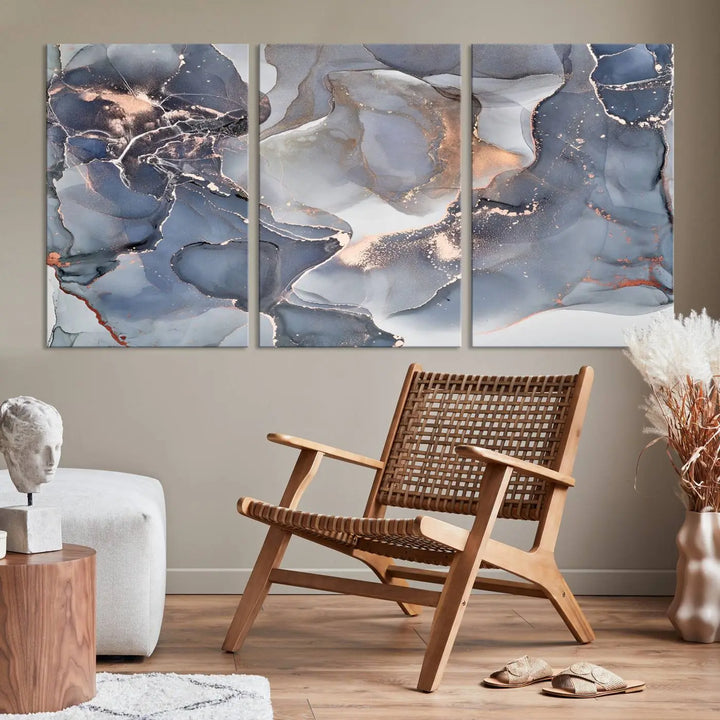 A Contemporary Art Gray Gold Abstract Canvas Art Print on museum-quality canvas adorns the modern living room.