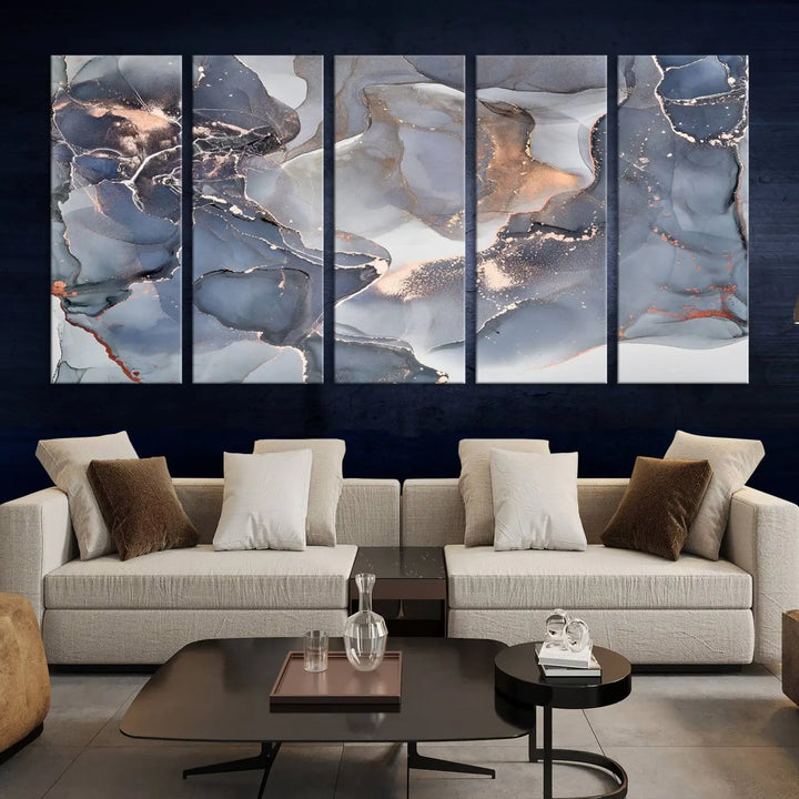 A Contemporary Art Gray Gold Abstract Canvas Art Print on museum-quality canvas adorns the modern living room.